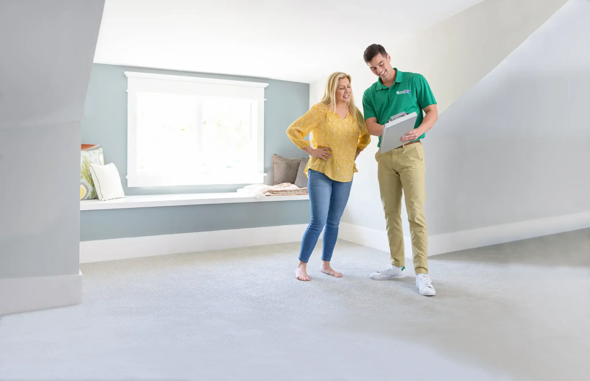 A Chem-Dry technician with a homeowner in a wool-carpeted Southern Highlands room