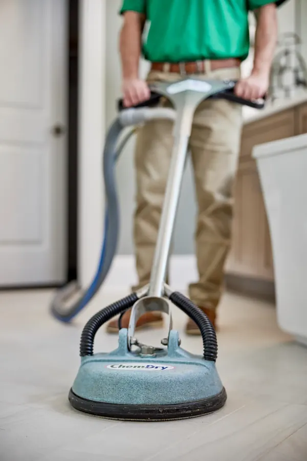 A Chem-Dry rotary floor machine cleaning a tiled floor