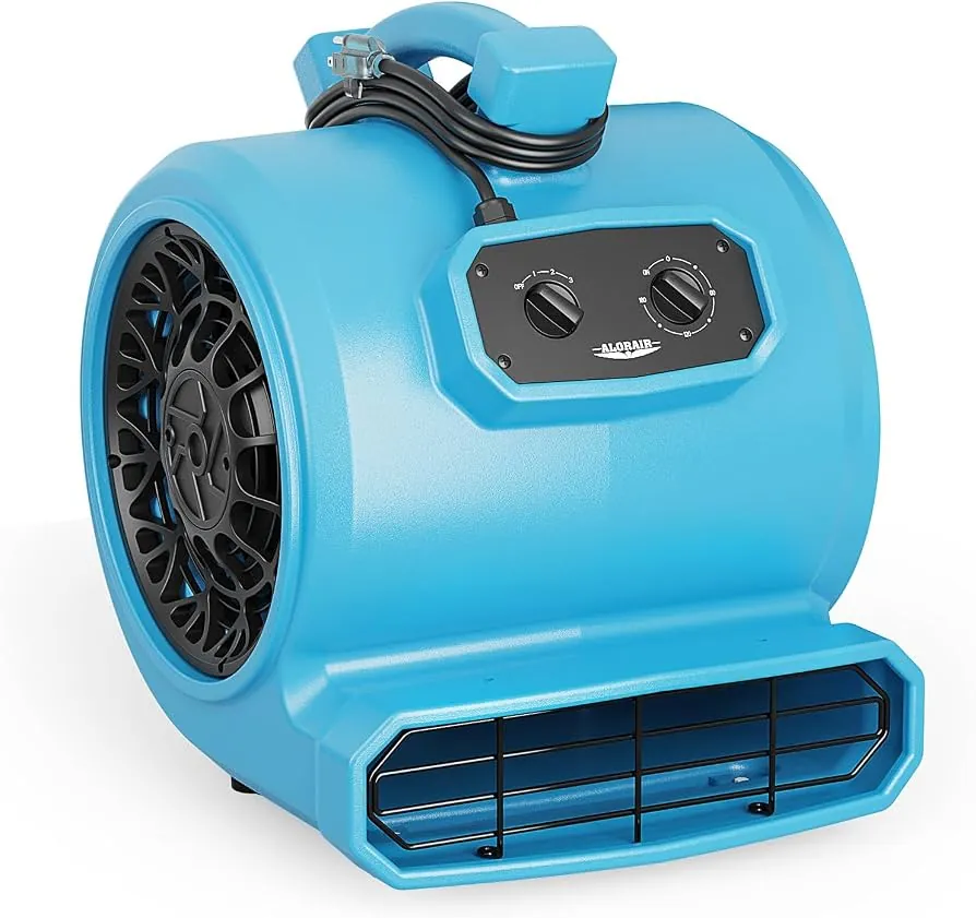 A high-velocity air mover drying a water-damaged floor